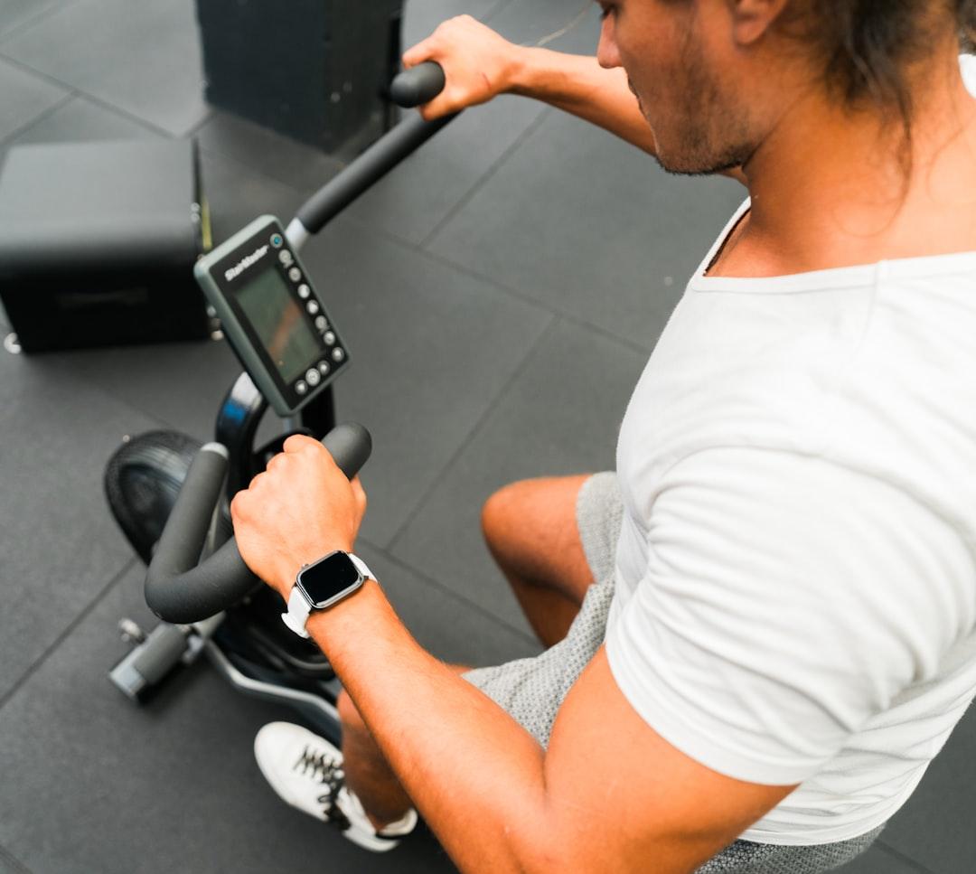 A person looking at a phone with motivational workout quotes on the screen