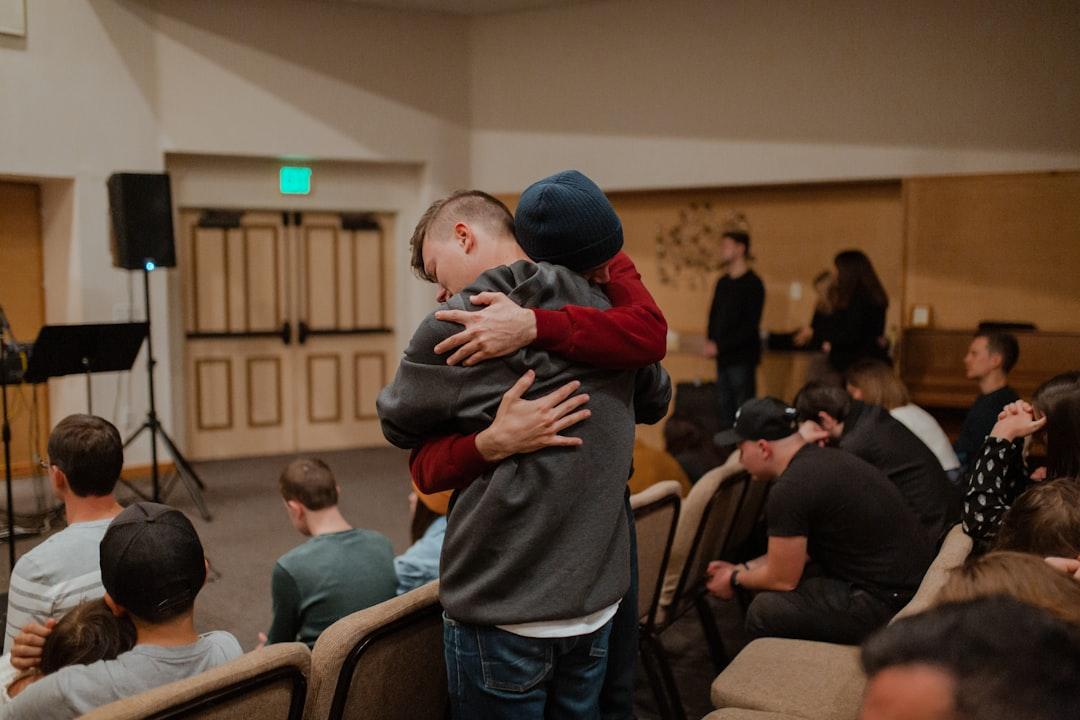 A touching moment between a father and his child, perhaps a hug