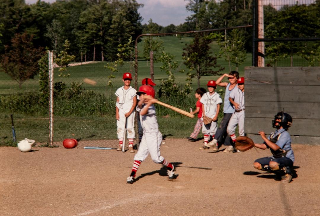 A vintage-style collage of images depicting key moments in Jackie Robinson's life - playing baseball, with his family, and during civil rights activities.