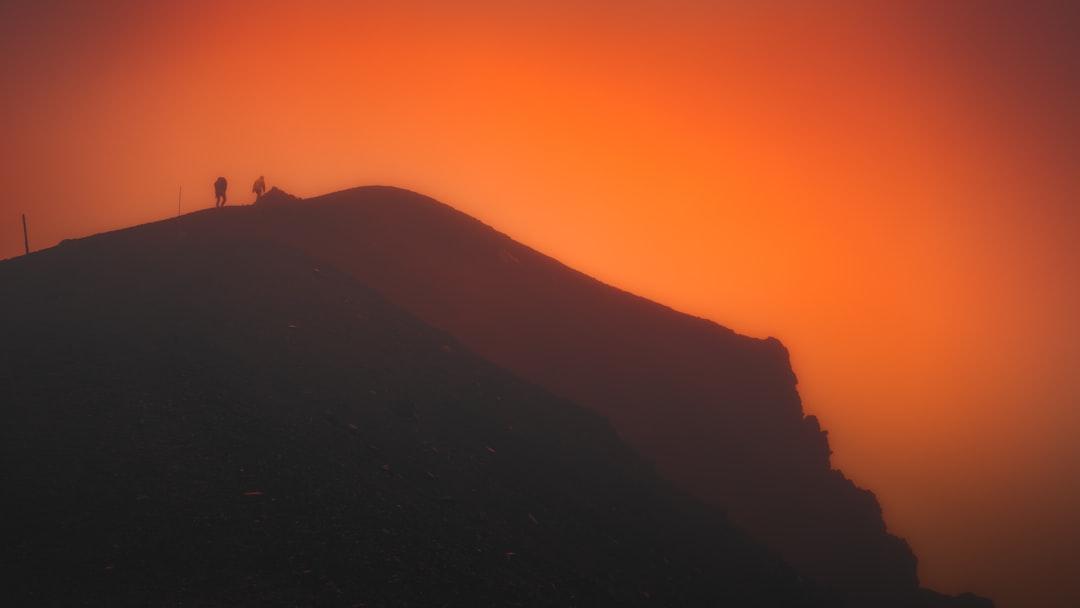 An abstract image representing success, perhaps a person reaching the peak of a mountain against a sunrise, conveying a sense of journey and achievement.