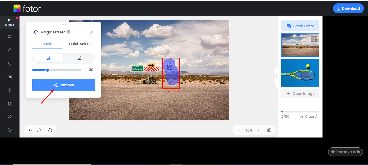 Fotor Magic Eraser marking an unwanted object on a roadside image for removal in the tool