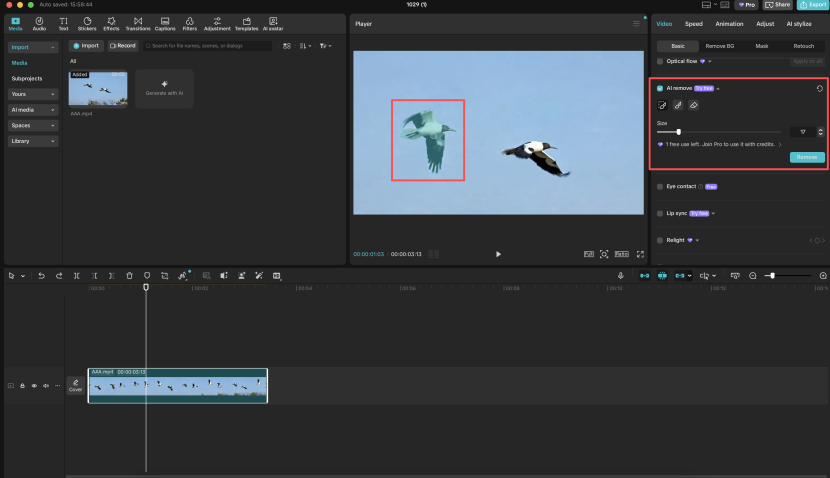 AI Remove brush controls marking one of two birds inside the CapCut desktop editor
