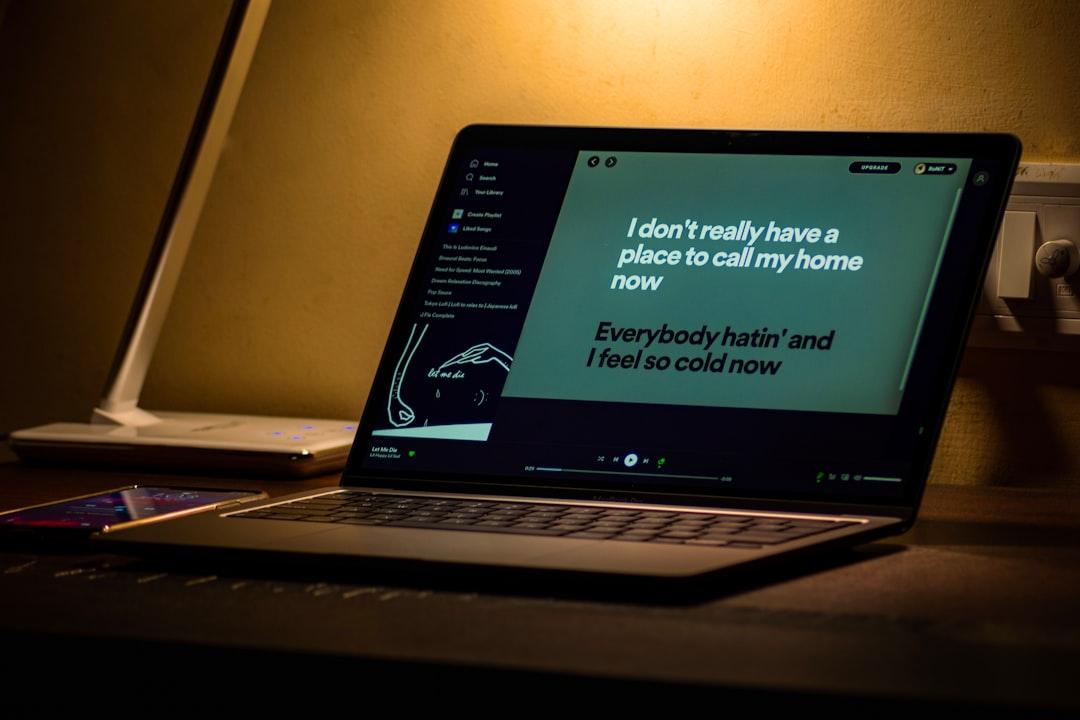 A person typing on a laptop, illustrating the act of writing and quoting.